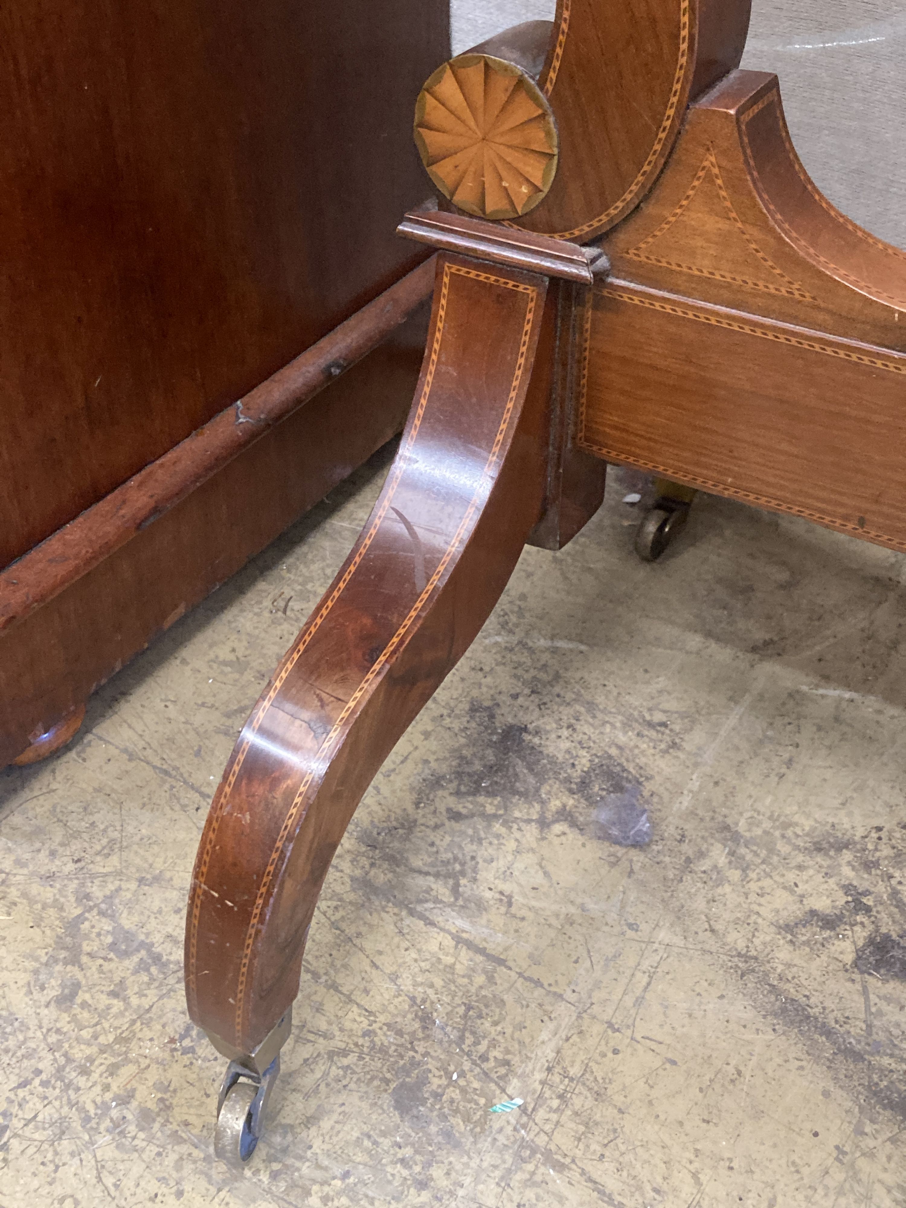 A large Edwardian inlaid mahogany shield shaped cheval mirror, width 80cm, height 177cm
